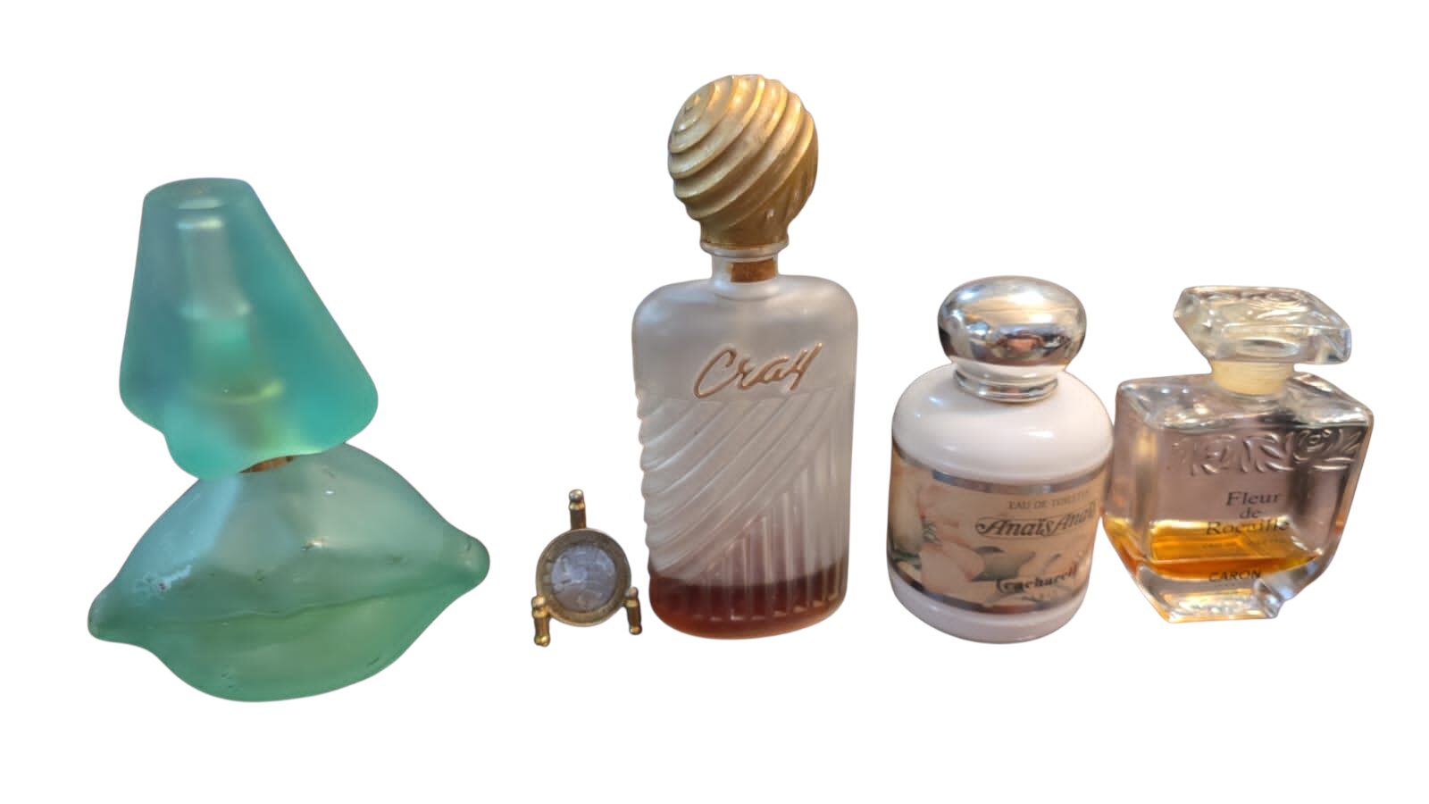 Lote com quatro antigos perfumes