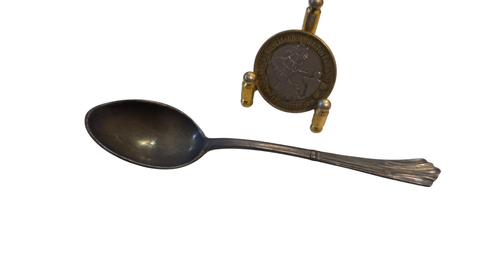 Antiga colher espessurada a prata