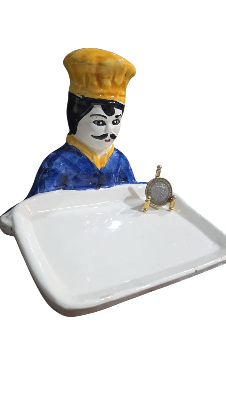 Antiga escultura de cozinheiro de louça