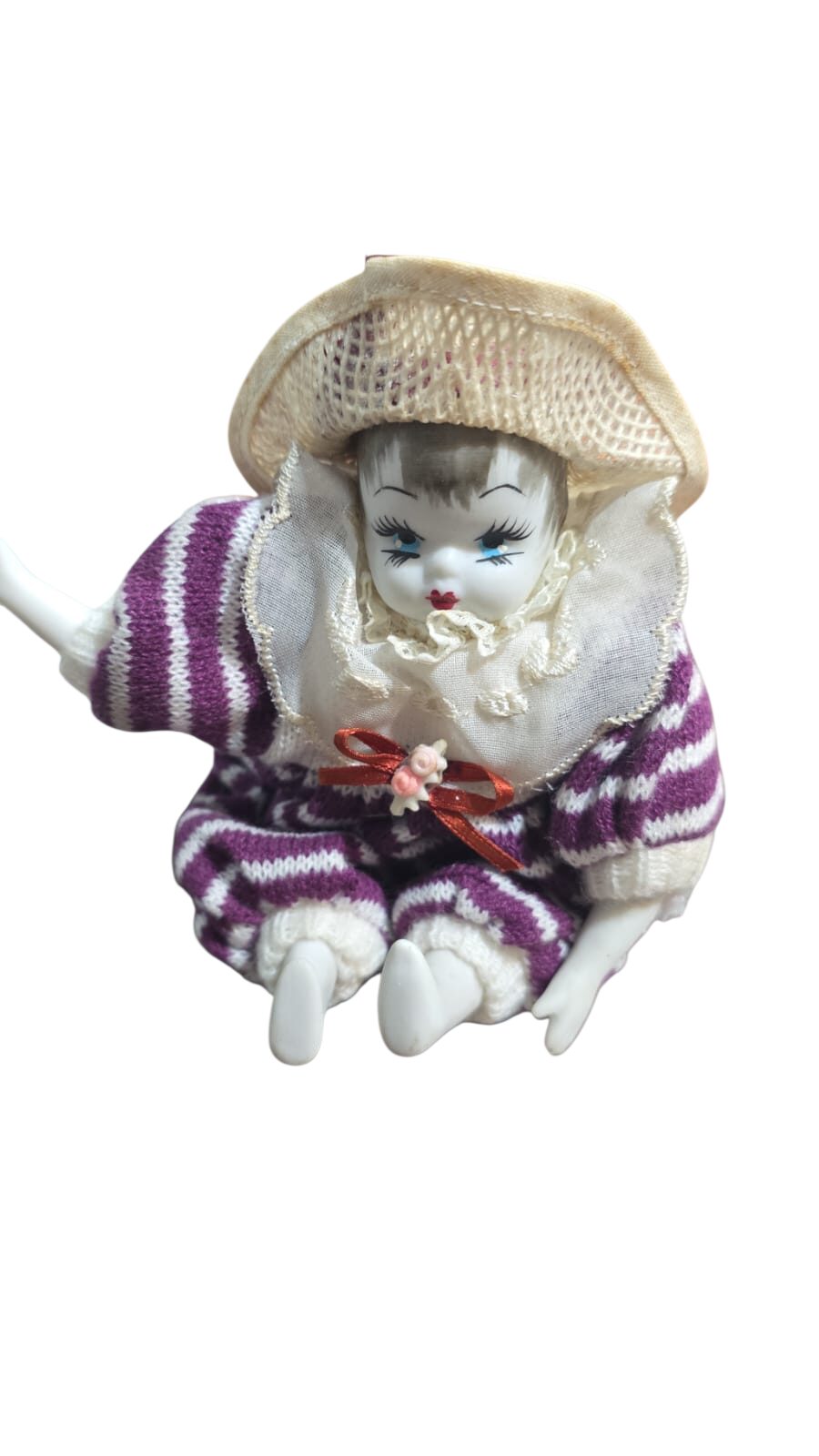 Boneca antiga em porcelana em tecido