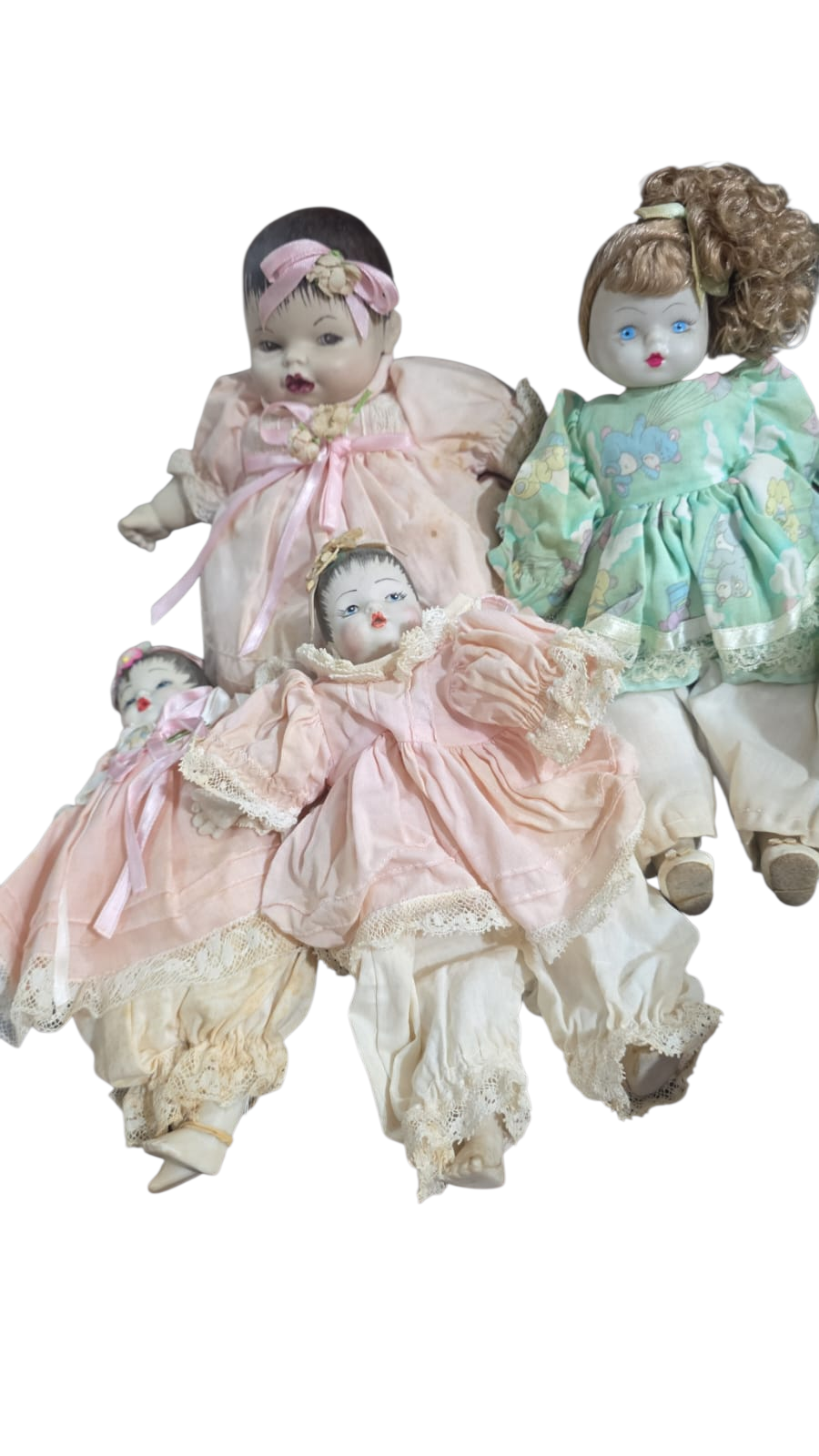Quarteto de bonecas antigas de porcelana e tecido