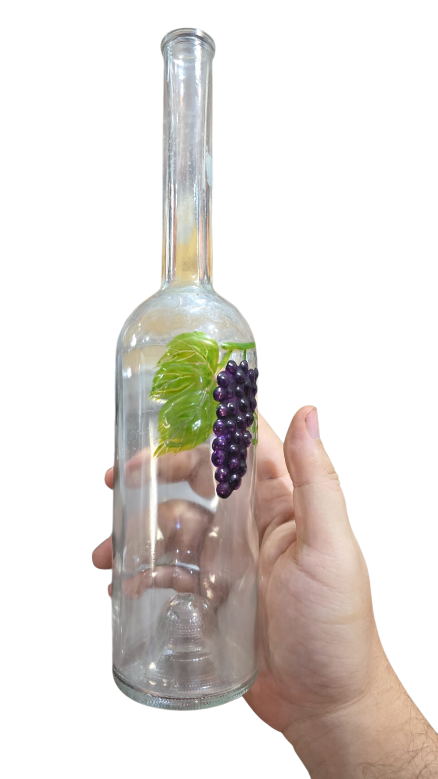 Decanter de vinho com vela, uva em relevo
