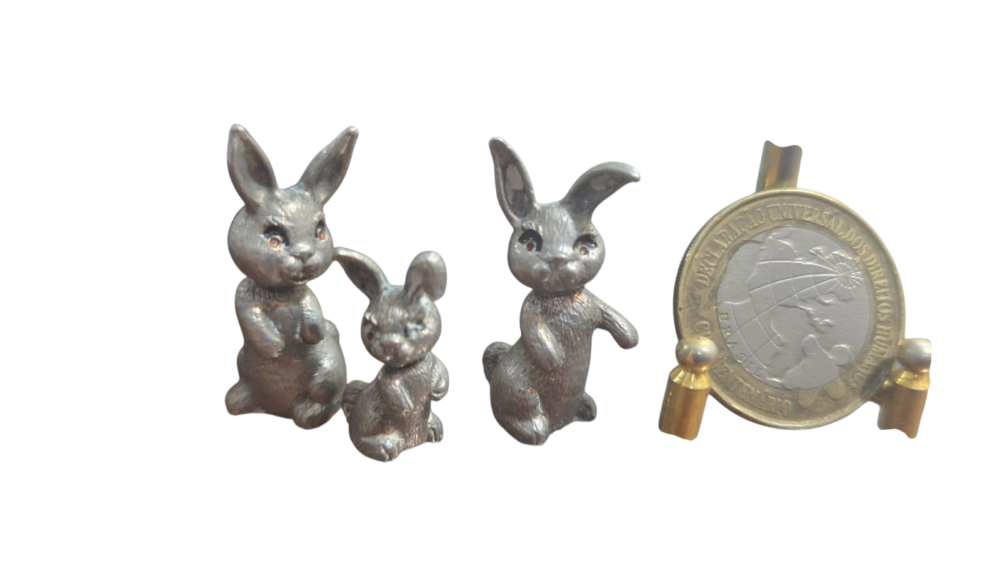 Antigo trio de coelhinhos de metal