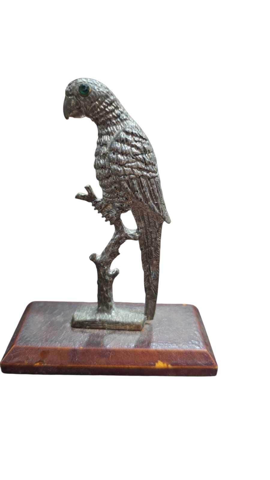 Pássaro de metal com incrustação no olho