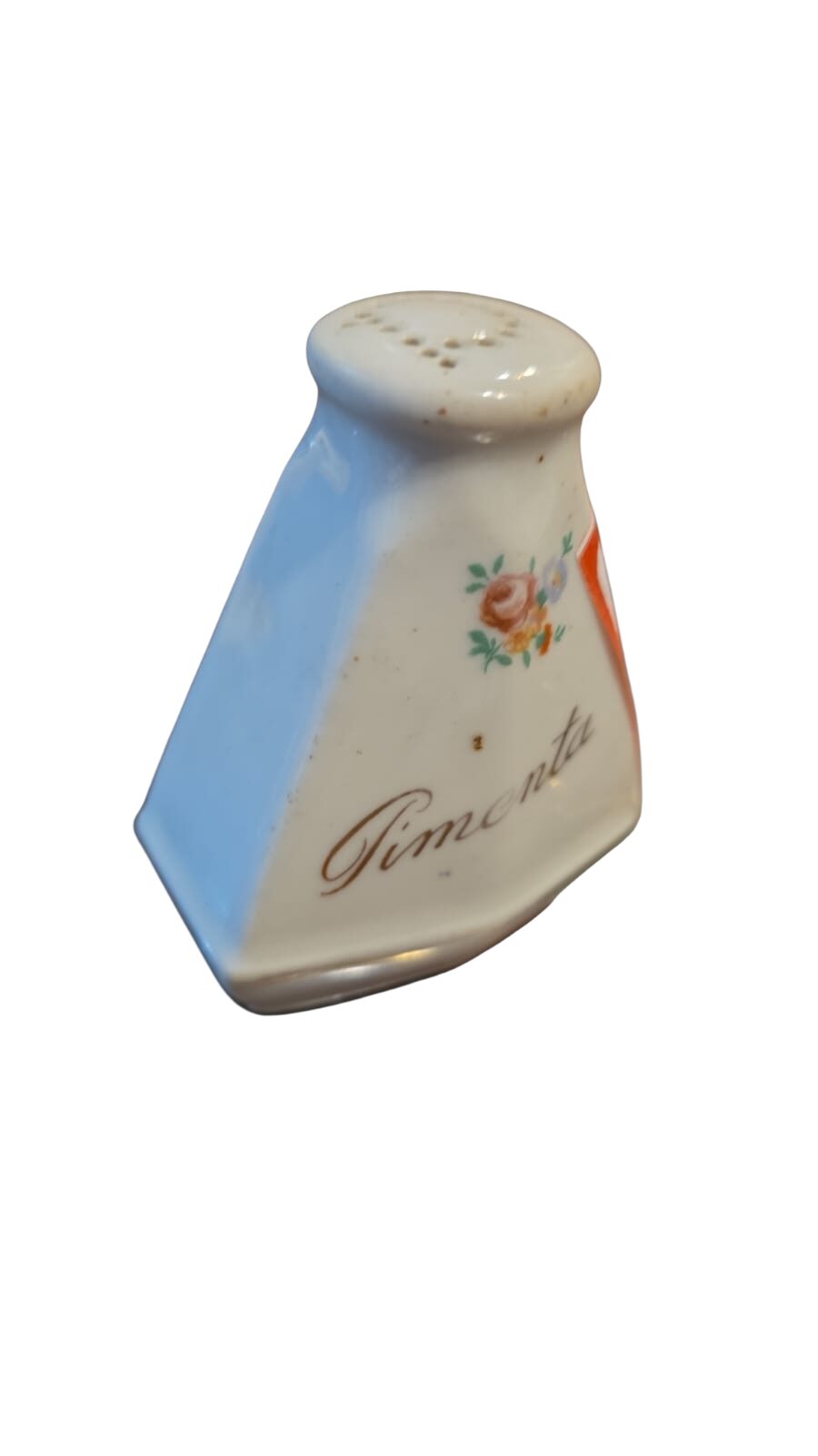 Antigo pimenteiro de porcelana