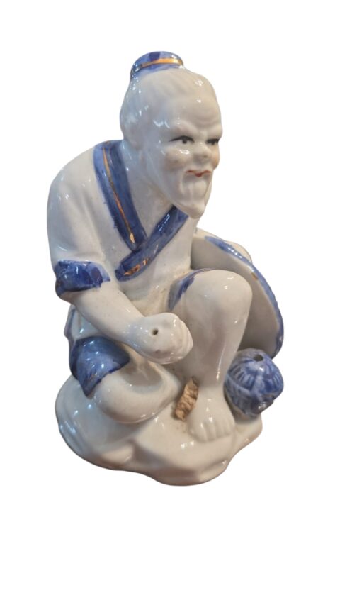 Escultura oriental de porcelana