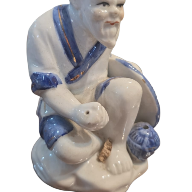 Escultura oriental de porcelana