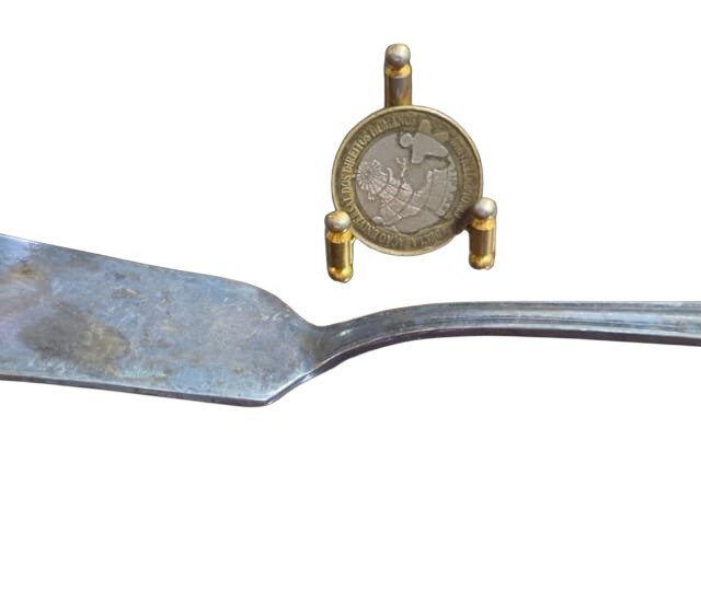 Antiga espátula espessurada a prata